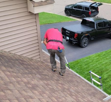 A Weather-Tite Technicial Performing A Roof Inspection